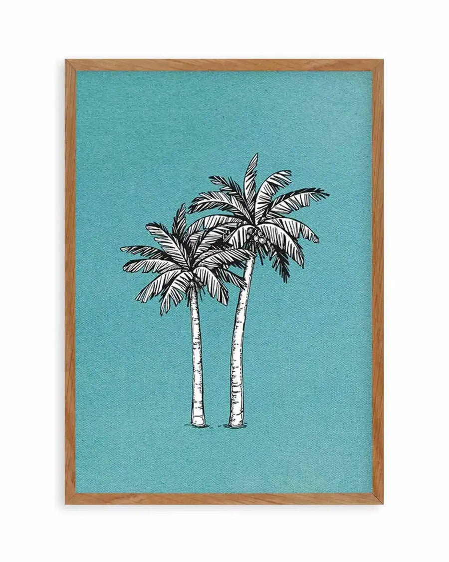 Art print featuring two hand-drawn palm trees with black outlines and white fill, set against a textured teal background, displayed in a natural oak frame with white border.