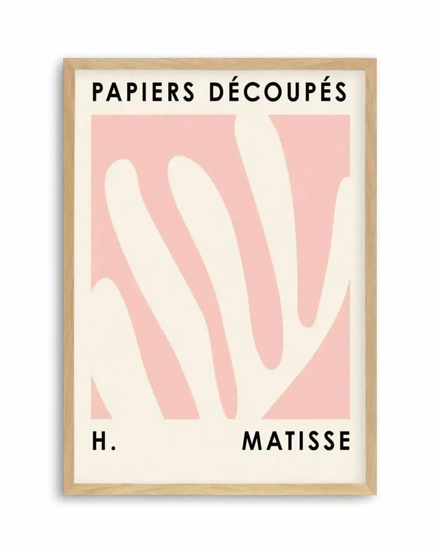 Art print featuring abstract, organic shapes in a soft blush pink on a cream background, reminiscent of Henri Matisse's cut-out works. The print is displayed in a natural oak frame with a white border, and includes the text "PAPIERS DÉCOUPÉS" at the top and "H. MATISSE" at the bottom in black sans-serif font.