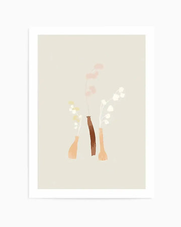 Art print featuring three minimalist vases in earthy tones, each holding delicate branches with small, soft-hued flowers. The left vase is light peach and holds yellow-cream flowers, the middle vase is dark brown and holds pale pink flowers, and the right vase is light brown and holds white flowers. The background is a soft, light beige.