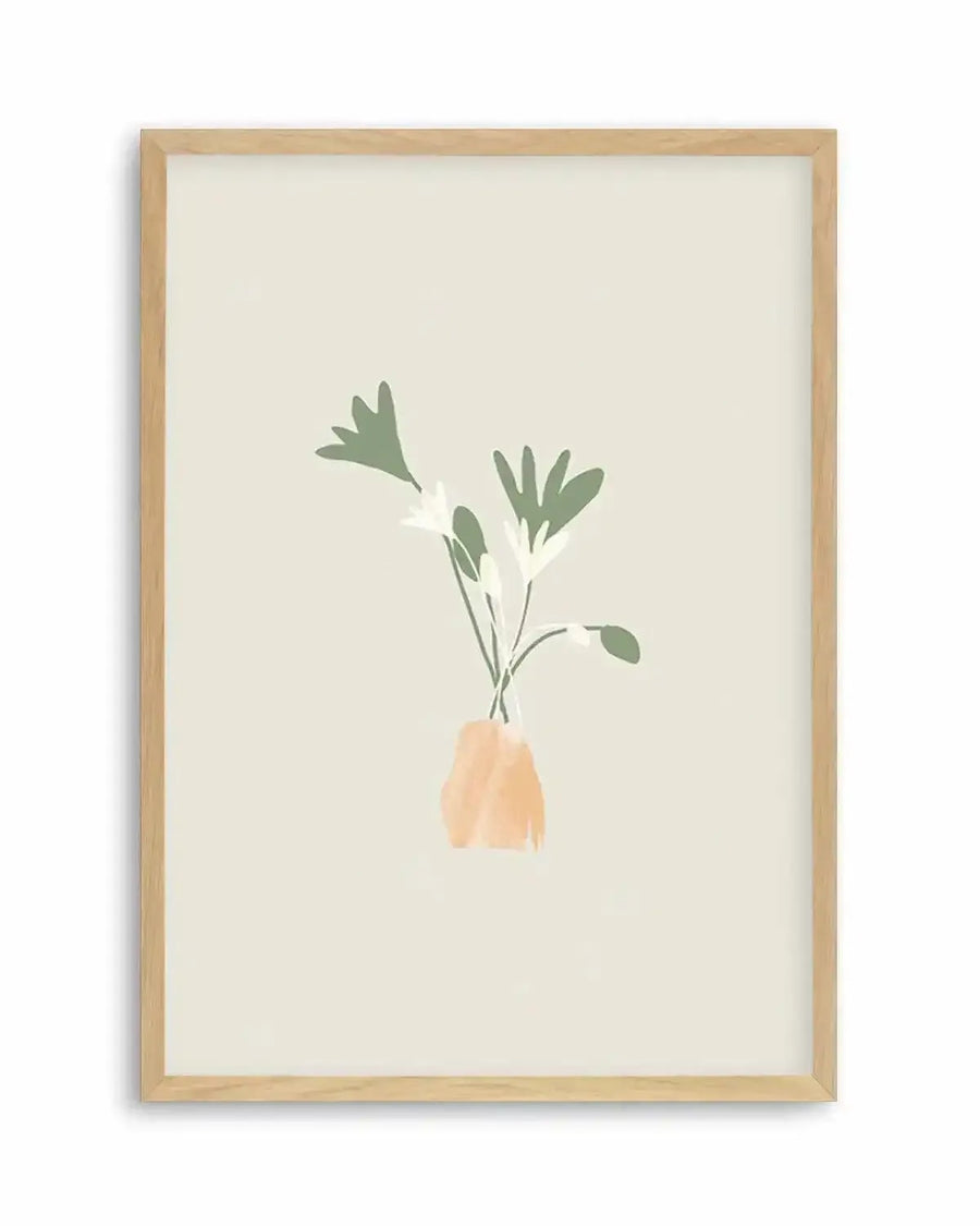 Watercolour art print featuring a minimalist illustration of three flowers with dark green leaves and white petals in an abstract peach-coloured vase, printed on fine art paper and displayed in a natural oak frame with white border.