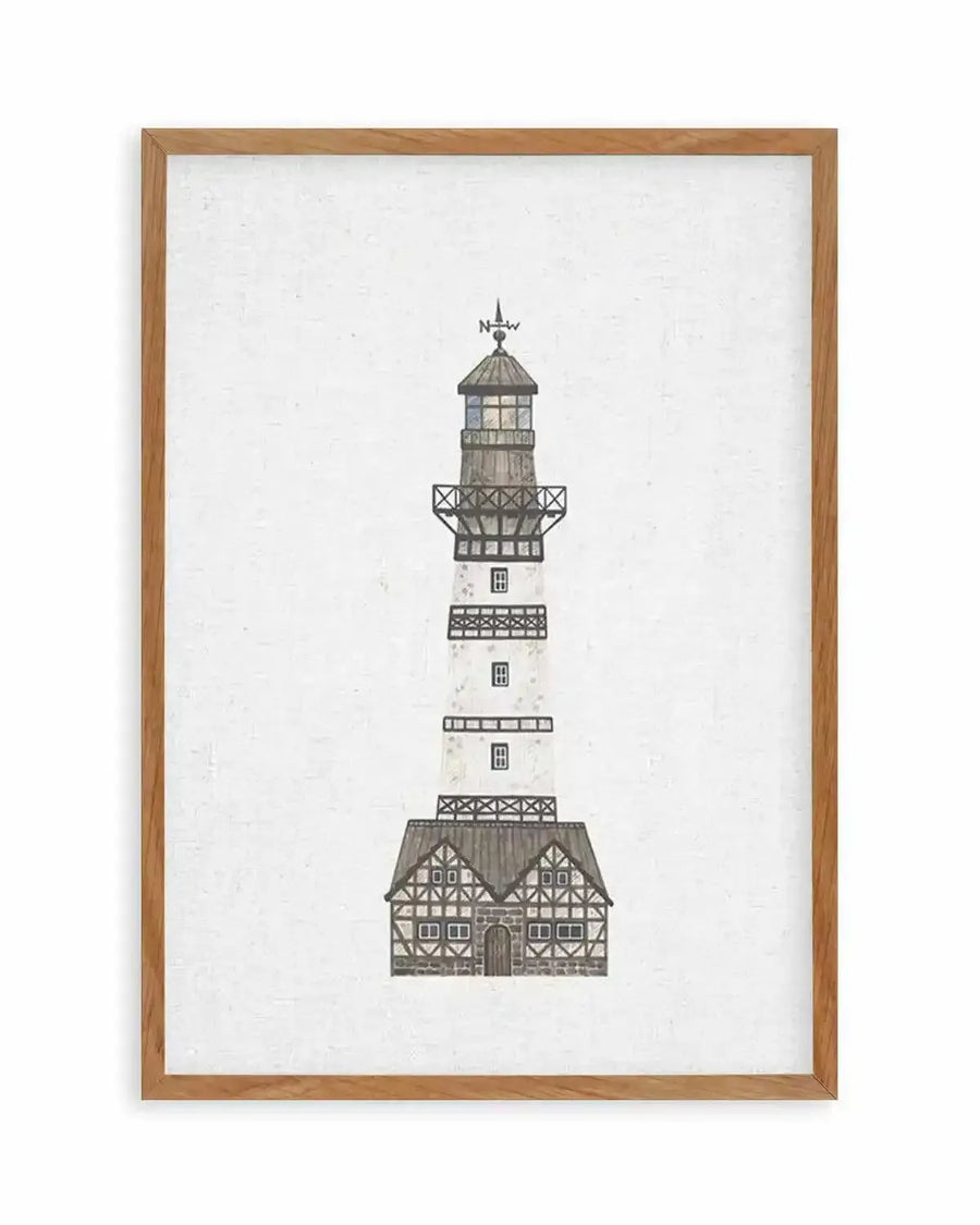 Watercolour art print featuring a tall, narrow lighthouse with a white base and a dark grey, shingled roof, displayed in a natural oak frame with white border. The lighthouse has a weather vane at the top indicating "N" and "W", and a small house-like structure at its base with a dark grey roof and white walls with dark grey timber framing. The background is a textured white, resembling linen.