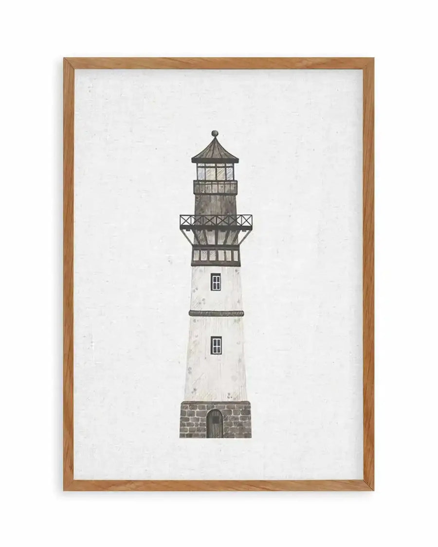 Watercolour art print featuring a tall, slender lighthouse with a white body and a dark grey top section, printed on fine art paper and displayed in a natural oak frame with white border. The lighthouse has a stone base with a small arched door, two small windows with dark frames, and a detailed lantern room with a conical roof.