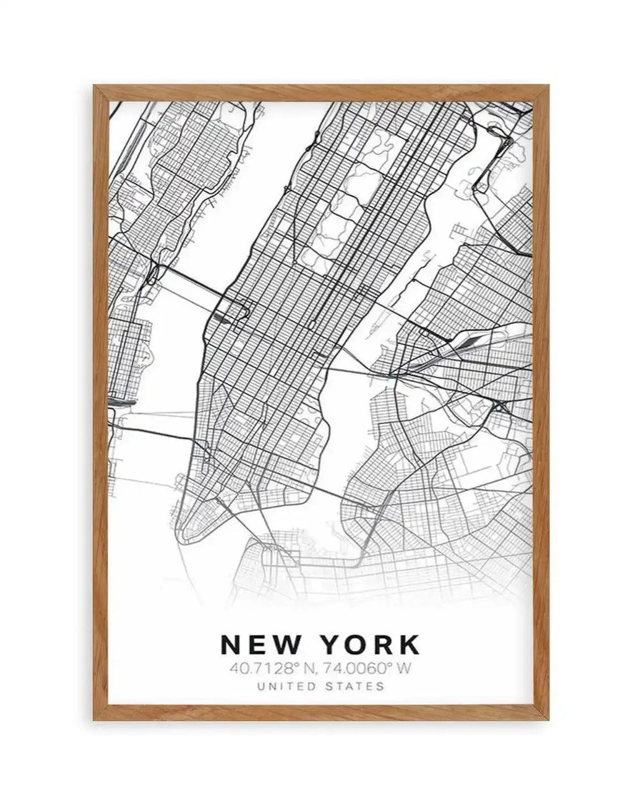 Line art map print of New York City, featuring a detailed black and white street map of Manhattan and surrounding boroughs, with the Hudson River and East River clearly visible. The map fades to white at the bottom, where the text "NEW YORK", "40.7128° N, 74.0060° W", and "UNITED STATES" is printed in black. The print is displayed in a natural oak frame with a white border.