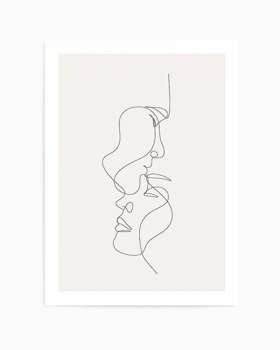 Line art print featuring two faces in profile, facing each other in an embrace, drawn with a single continuous black line on a soft white background, printed on fine art paper and displayed in a white frame with a white border.