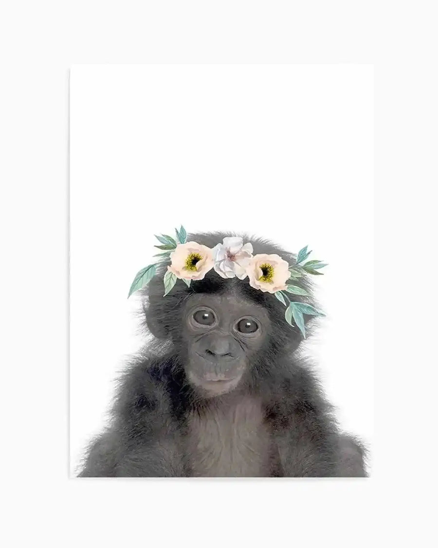 Watercolour art print featuring a baby chimpanzee with dark grey fur and large, curious eyes, wearing a delicate flower crown with cream and pale yellow blossoms and soft green leaves, set against a clean white background.