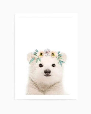 Watercolour art print featuring a baby polar bear with a flower crown on its head, against a plain white background. The polar bear has white fur, black eyes, and a black nose. The flower crown consists of three light yellow flowers with dark centers and light green leaves.