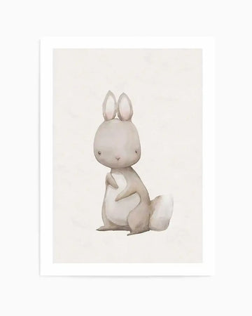 Watercolour art print featuring a cute, stylized rabbit with soft grey fur and large ears, sitting upright with its head slightly tilted and a small, fluffy white tail, on a warm cream background.