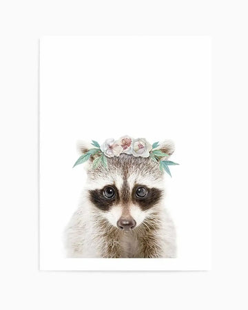 Watercolour art print featuring a baby raccoon wearing a flower crown, set against a plain white background. The raccoon has soft grey and white fur, dark brown eye patches, and a small pink nose. The flower crown consists of delicate white and blush pink flowers with soft green leaves.