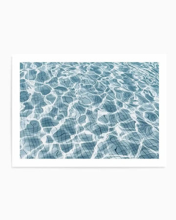 Product shot art print of a swimming pool with light blue water and a tiled bottom, showing the distorted grid pattern of the tiles through the rippling surface. The sunlight creates bright, dancing reflections on the water.