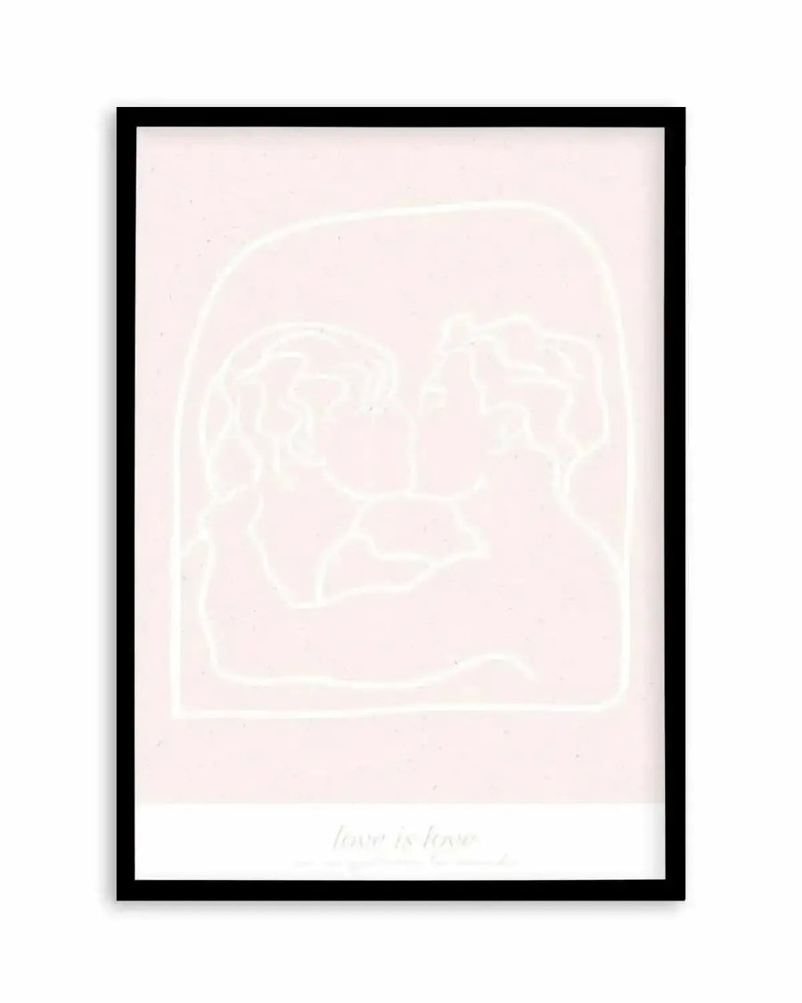 Art print featuring a minimalist line drawing of two figures embracing and kissing, rendered in a pale cream outline against a soft blush pink background. The figures are enclosed within a subtle arched outline, and the words "love is love" are faintly visible in the bottom section. The print is displayed in a sleek black frame with a white border.