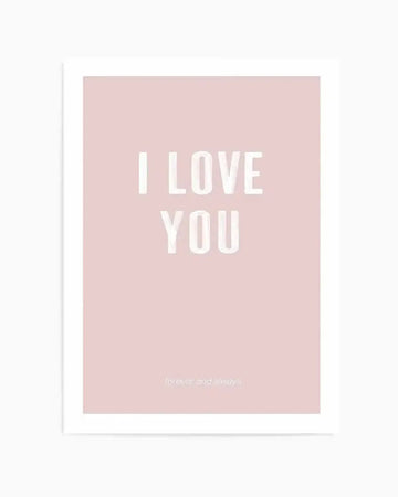 Art print on blush pink background featuring large white sans-serif text reading "I LOVE YOU" centered on the page, with smaller white text reading "forever and always" at the bottom. The print is mounted in a white frame with white border and displayed against a neutral background.
