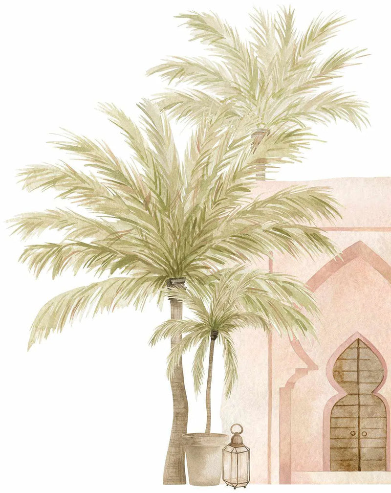 Peel and stick wallpaper featuring a hand-painted watercolour design of three palm trees with feathery green fronds in the foreground, and a pale pink Moroccan-style building with arched windows and doorways in the background. A small potted palm and a decorative lantern sit at the base of the trees.