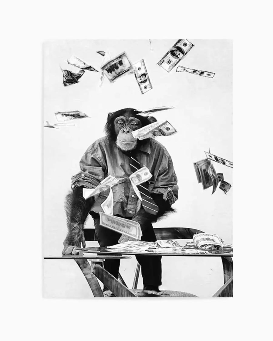 Black and white art print featuring a chimpanzee in a collared shirt and striped tie, sitting at a glass table with money scattered around and falling from above. The chimp has a serious expression, with some bills stuck to its mouth, creating a humorous and chaotic scene. The composition captures the dynamic movement of the falling money against a plain white background.