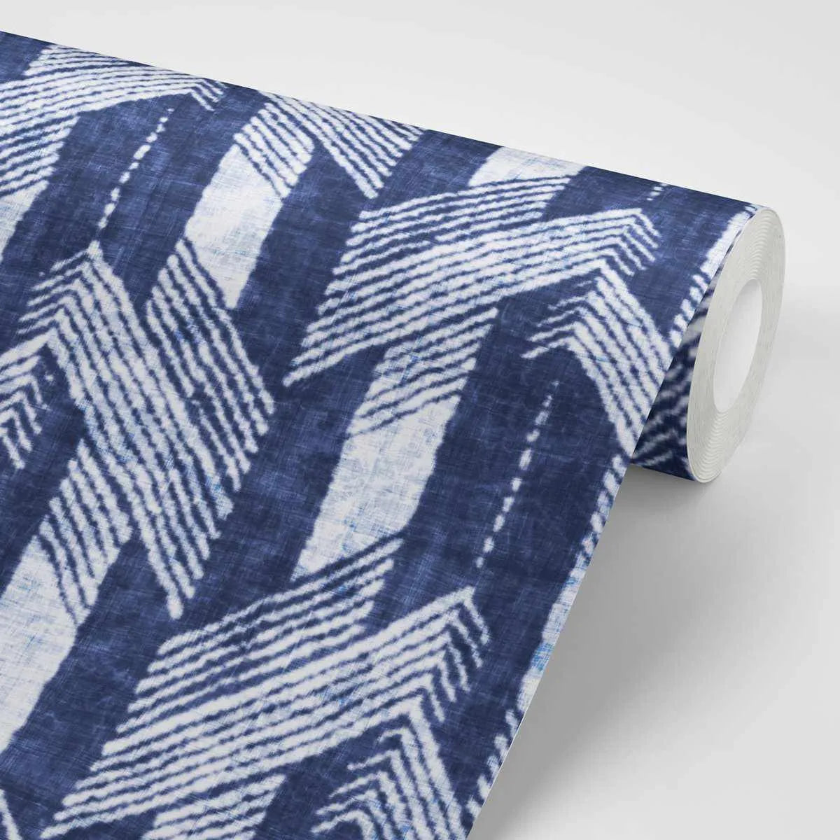 Rolled navy wallpaper featuring a geometric herringbone pattern in white and light blue stripes. The design consists of repeating chevron shapes that create a woven, textured appearance. The wallpaper has a linen-like finish with a subtle fabric texture visible throughout. The roll is partially unrolled to display the pattern against a neutral background.