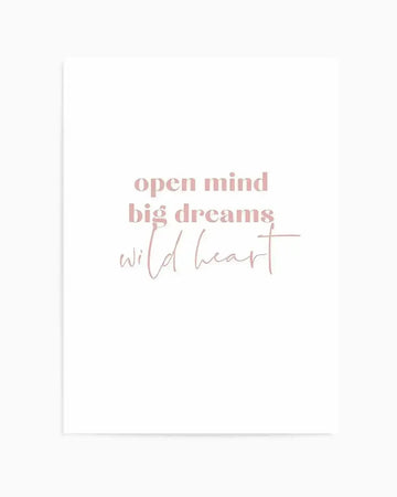 Art print featuring the phrase "open mind big dreams wild heart" in a soft, dusty rose pink. The first two lines, "open mind" and "big dreams," are in a clean, sans-serif font, while "wild heart" is in a delicate, flowing script. The text is centered on a clean white background.