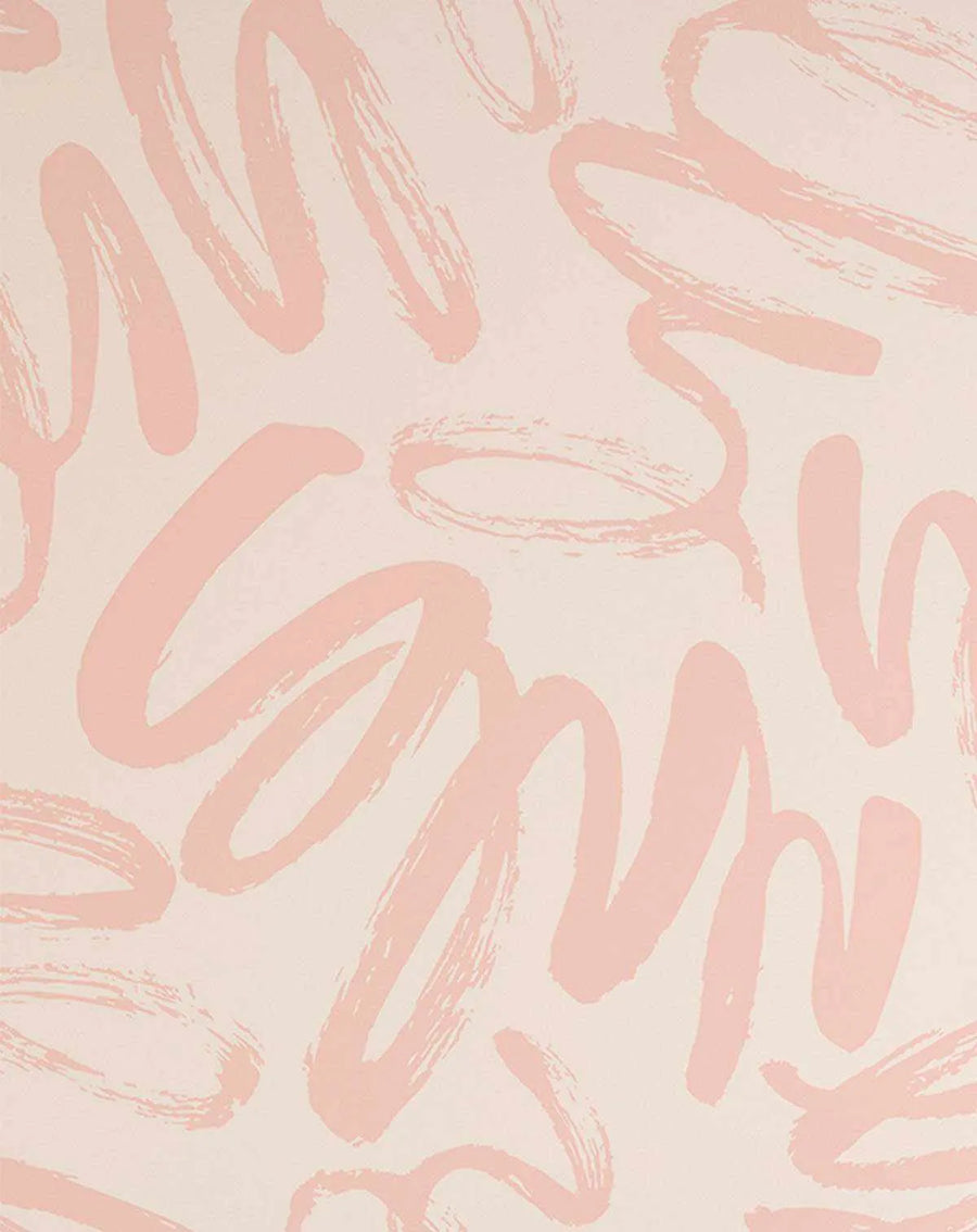 Peel and stick wallpaper featuring a repeating pattern of hand-painted, abstract brushstrokes in a soft peachy pink on a light cream background. The design has a loose, graffiti-like quality with visible brushstroke texture and varying thicknesses.