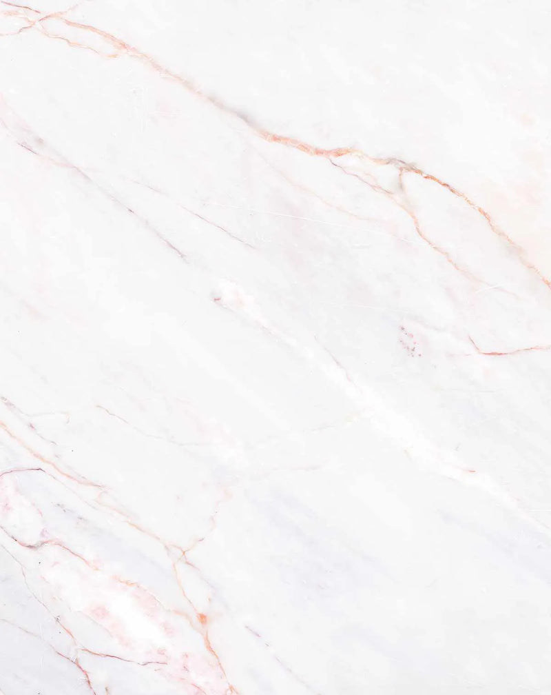Peel and stick wallpaper featuring a repeating pattern of white marble with delicate veins in soft blush pink and subtle rose gold, creating a natural and elegant stone texture.