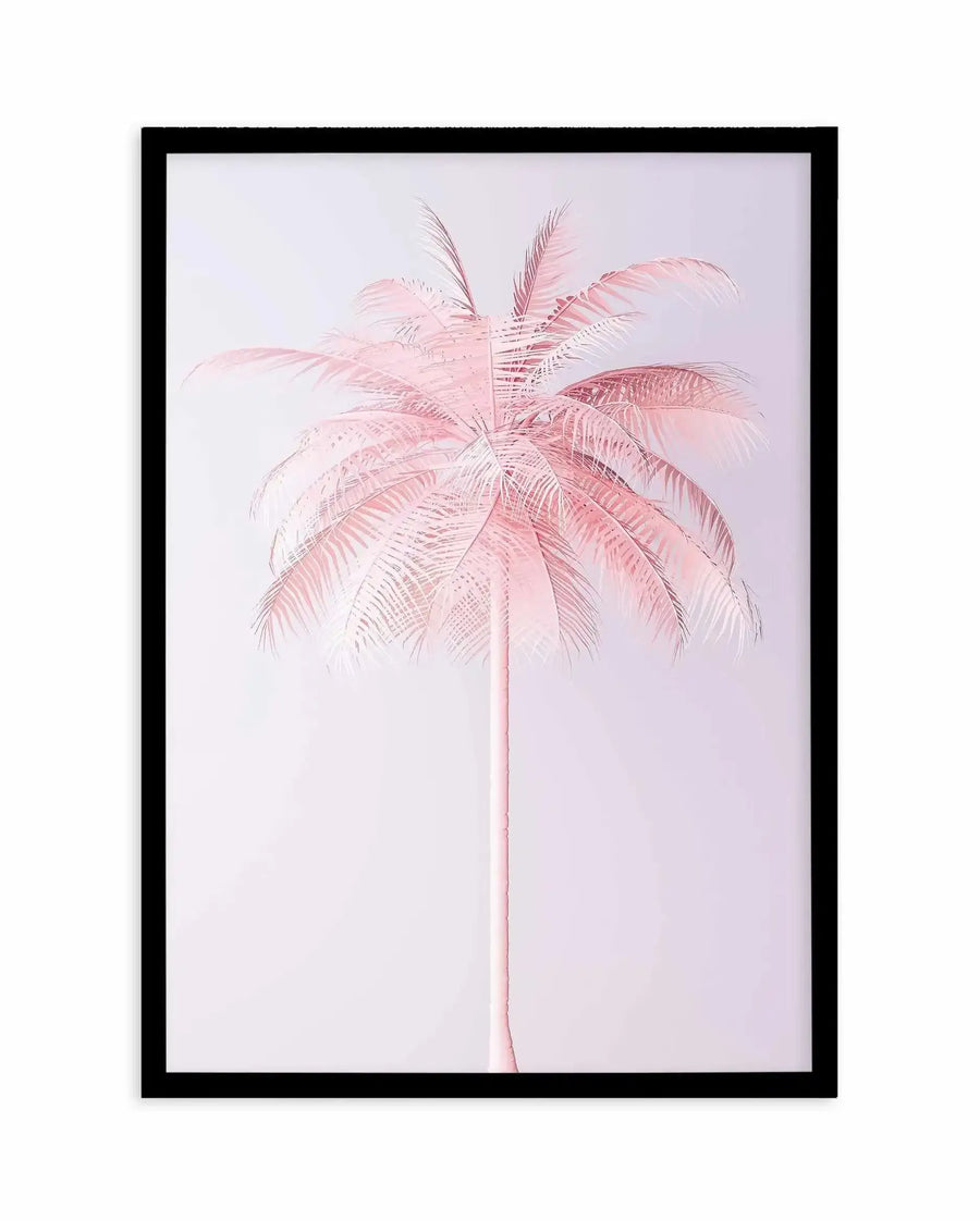 Framed art print featuring a delicate illustration of a single pink palm tree with a thin, pale pink trunk extending from bottom to top. The palm fronds radiate outward in soft, feathered strokes rendered in varying shades of dusty rose and blush pink against a pale lavender-white background. The illustration has a minimalist, botanical quality with fine line work creating texture throughout the foliage. The artwork is displayed in a black frame with a white border.