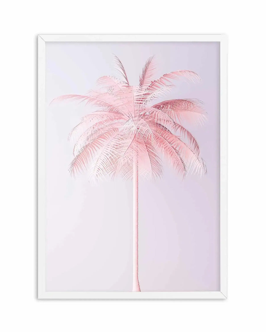 Framed art print featuring a single palm tree rendered in soft pink tones against a pale lavender background. The palm has a slender, light pink trunk and feathered fronds that radiate upward in varying shades of dusty rose and blush pink, with fine line detailing suggesting a watercolor or botanical illustration style. The artwork is presented in a white frame with a white border, centered on the vertical canvas with ample negative space below and around the tree.