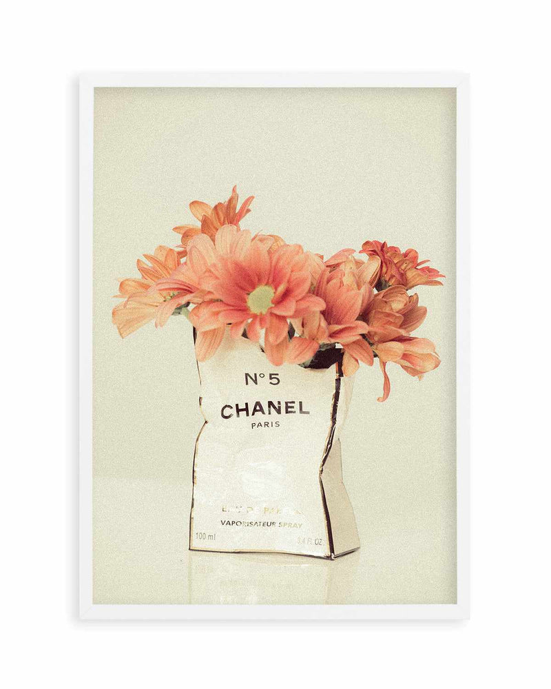 A bottle of chanel no 5 next to flowers photo  Free Bottle Image on  Unsplash