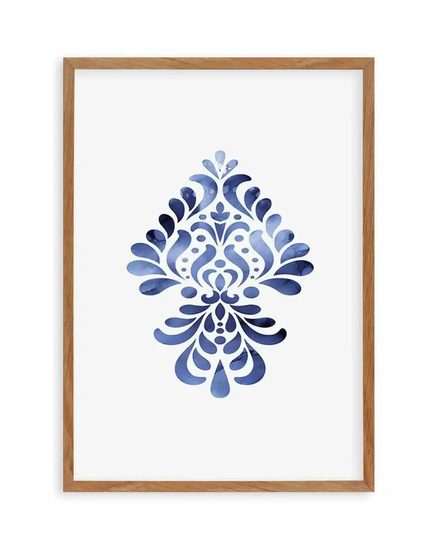 Watercolour art print featuring a symmetrical damask-style motif in varying shades of blue, with organic, fluid brushstrokes and subtle speckling, displayed in a natural oak frame with white border.