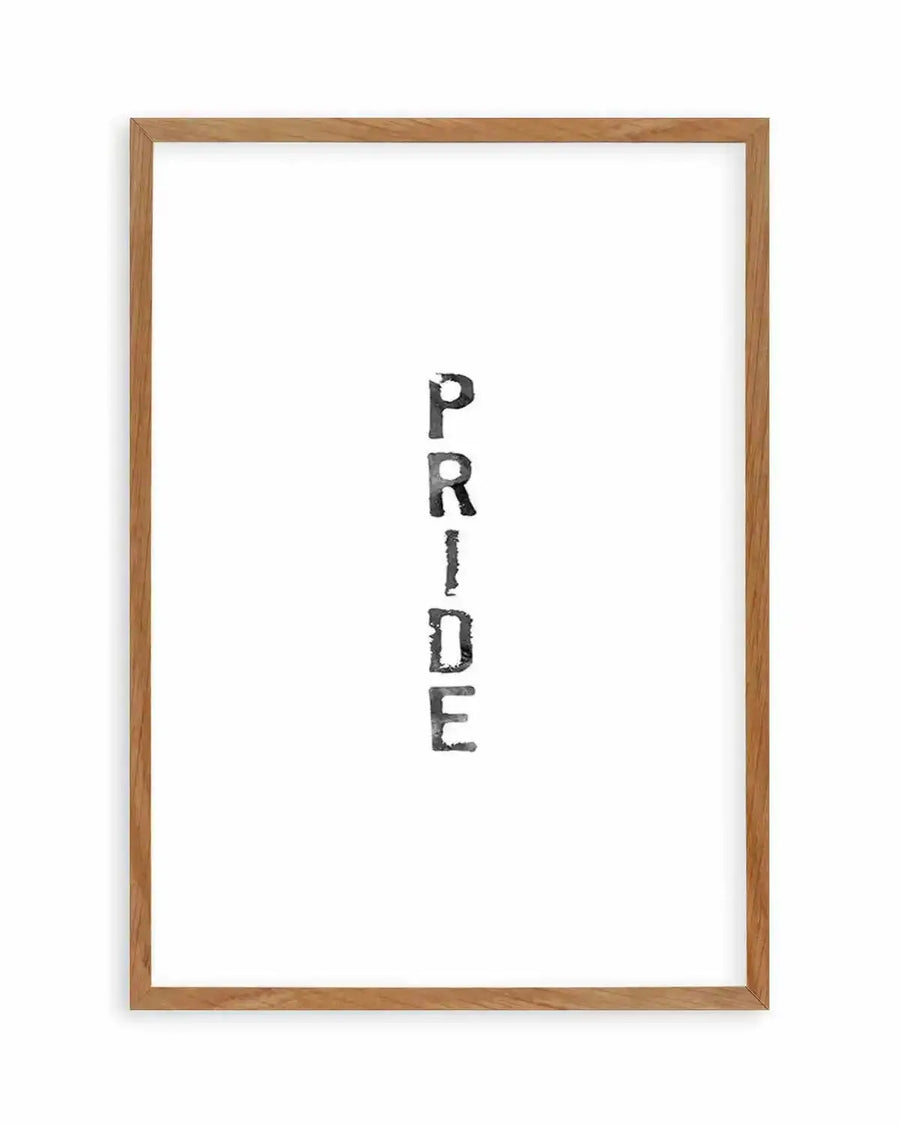 Watercolour art print featuring the word "PRIDE" stacked vertically in a distressed, black font on a white background, displayed in a natural oak frame with white border.