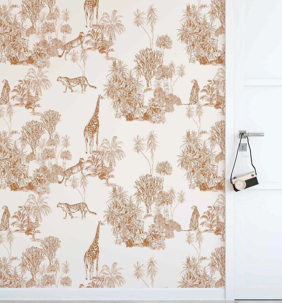 "Peel and stick wallpaper featuring a repeating pattern of hand-drawn safari animals and lush vegetation in a terracotta brown hue on a soft white background. The design includes giraffes, cheetahs, palm trees, and various other tropical plants, creating a detailed and organic illustration style."