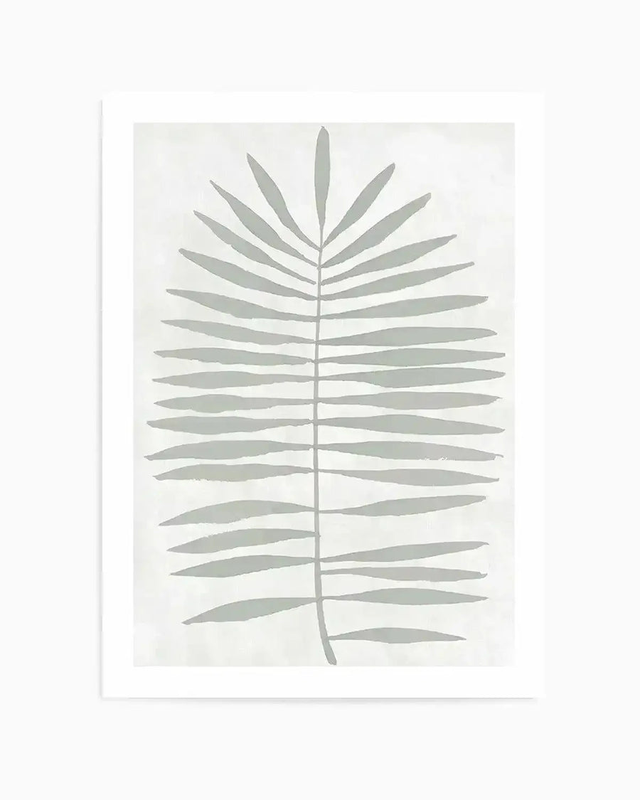 Art print featuring a single, large palm frond illustration in a muted sage green on a soft white background. The frond has a central stem with numerous elongated, narrow leaves extending outwards, depicted with a loose, hand-painted quality and visible brushstroke texture.
