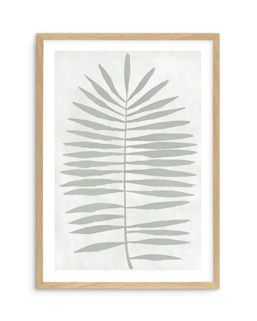 Watercolour art print featuring a single sage leaf in a soft, muted grey with visible brushstroke texture on a light cream background, displayed in a natural oak frame with white border.