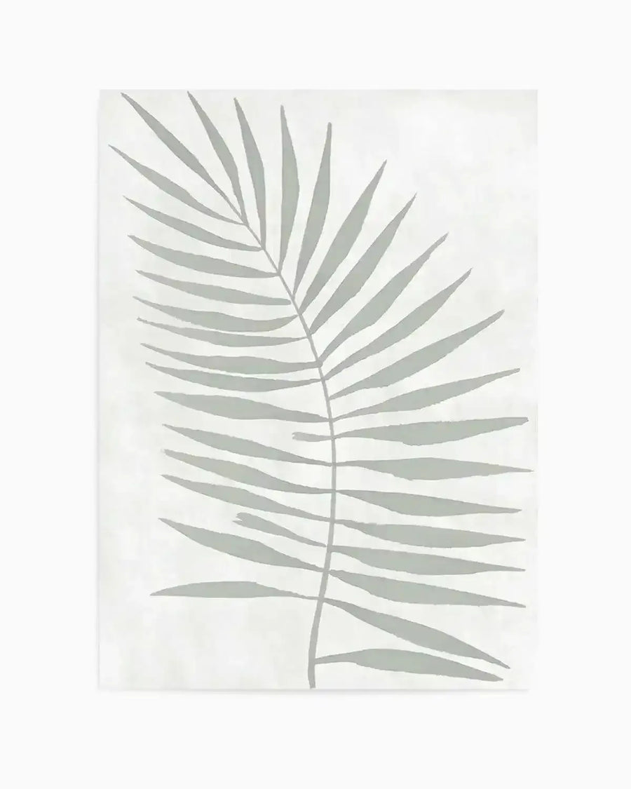 Art Print:
"Art print featuring a single palm frond with multiple long, slender leaves extending from a central stem, rendered in a muted sage green against a soft white background. The design has a minimalist, hand-painted quality with subtle brushstroke texture."