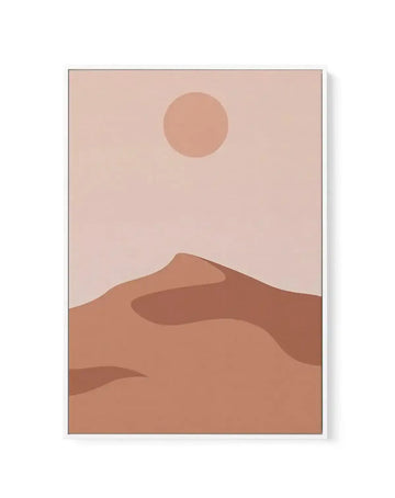 Art print featuring a minimalist desert landscape with a large, soft peach-pink sun against a pale blush sky, above rolling sand dunes in varying shades of terracotta and warm brown, displayed in a white frame with a white border.
