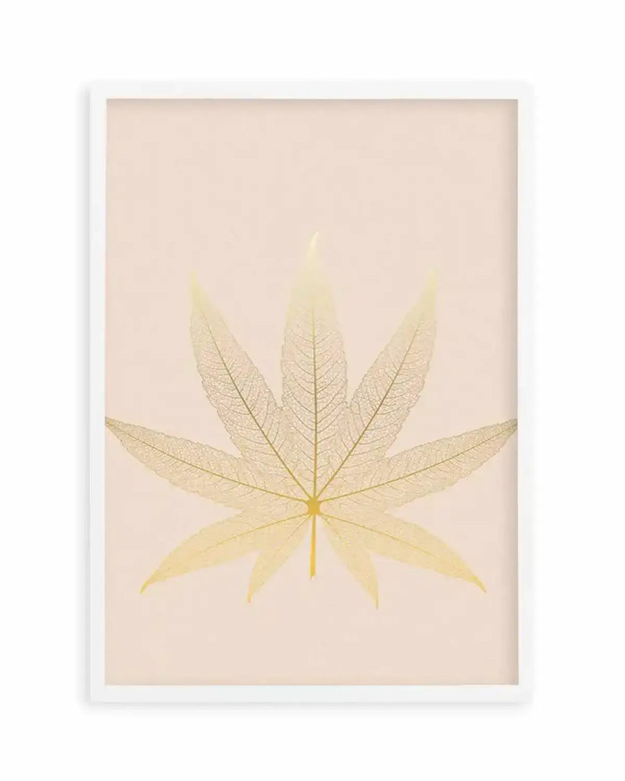 Framed art print featuring a delicate, skeletal cannabis leaf in translucent golden yellow against a soft blush pink background, with a white frame and white border. The leaf's intricate vein structure is clearly visible, creating a delicate, ethereal effect.