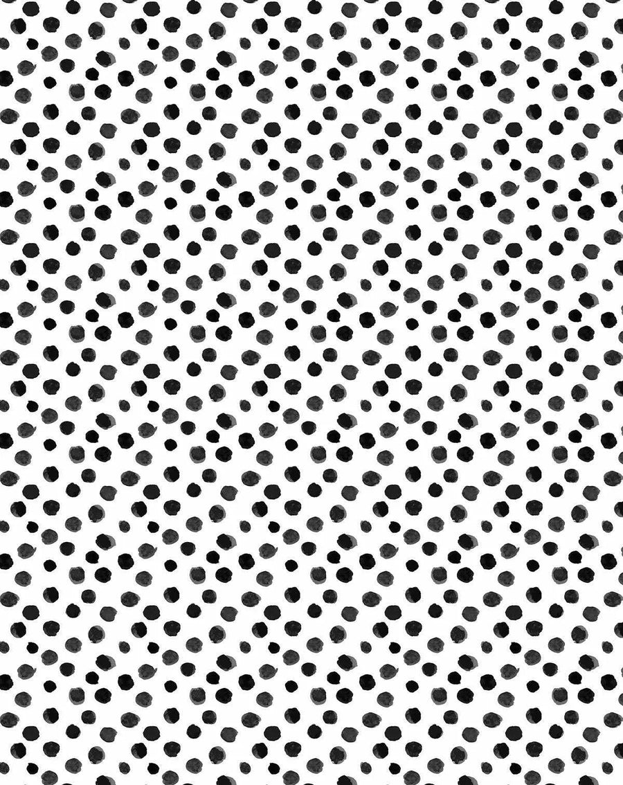 Peel and stick wallpaper featuring a repeating pattern of hand-painted irregular dots in varying shades of charcoal grey and black on a crisp white background. The design has a loose, organic watercolour quality with visible brushstroke texture.