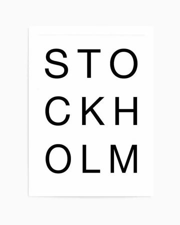 Stockholm art print featuring the word "STOCKHOLM" arranged vertically in three lines using a clean, sans-serif typeface in black text on a white background. The minimalist design has a modern, geometric aesthetic with generous white space surrounding the typography. The print appears to have a matte finish and is presented as a framed piece with a thin light gray or white border frame visible around the edges.