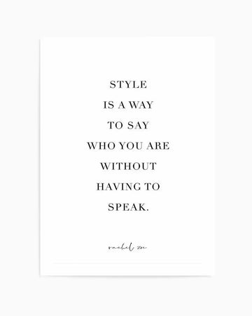 Art print with black serif typography on white background reading "STYLE IS A WAY TO SAY WHO YOU ARE WITHOUT HAVING TO SPEAK" centered on the page, with "rachel zoe" attributed in cursive script at the bottom. Clean, minimalist design with ample white space. Framed in white border.