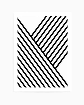 Abstract art print featuring two overlapping chevron or arrow shapes created entirely with parallel diagonal black lines on a white background. The lines run from upper left to lower right, with varying densities creating a geometric, minimalist composition. The design has a clean, modern aesthetic with high contrast between the black linework and negative white space. Presented as a framed print with a thin light gray border.