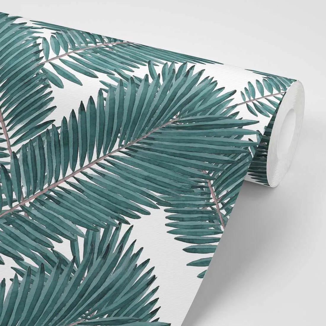 Peel and stick wallpaper featuring a repeating pattern of hand-painted palm fronds in deep teal and forest green on a bright white background. The botanical design has a loose, organic watercolour quality with visible brushstroke texture.