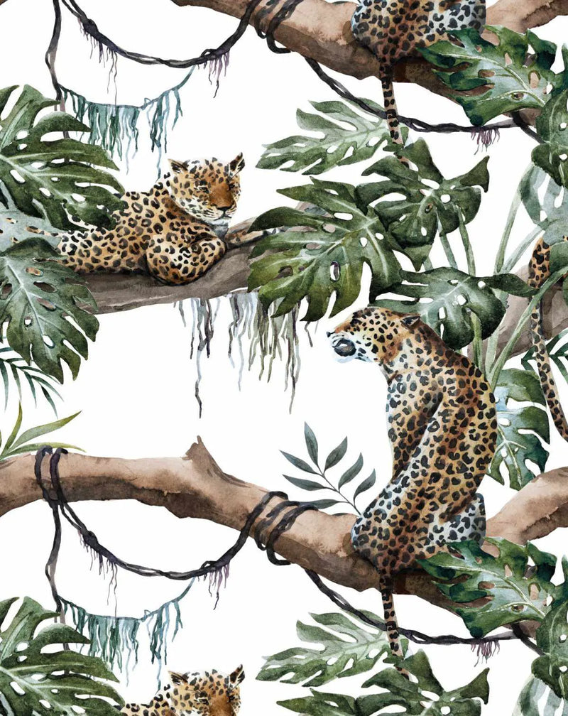 Peel and stick wallpaper featuring a repeating pattern of hand-painted leopards in a lush jungle setting on a white background. The design shows two leopards on thick brown branches with dark green monstera leaves and hanging vines. The leopards have spotted coats in shades of brown, black, and cream, with one lying down and the other sitting upright. The watercolour style gives a soft, organic texture to the botanical elements and animals.