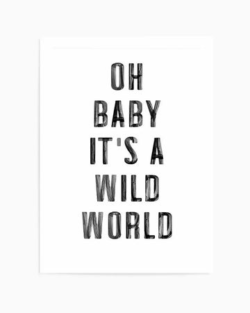 Art print featuring black hand-drawn lettering on a white background. Text reads "OH BABY IT'S A WILD WORLD" arranged in five centered lines. Letters have a sketched, distressed texture with visible line work and shading. The print is mounted on white paper with a thin white border visible around the edges.