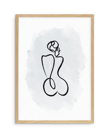 Framed art print with natural wood frame featuring an abstract line drawing on white paper with light gray watercolor wash background. The minimalist black ink illustration depicts a stylized figure with curved, organic shapes suggesting a seated or reclining female form with rounded contours. The composition is centered vertically within the frame, creating a contemplative, modern aesthetic with soft tonal qualities.