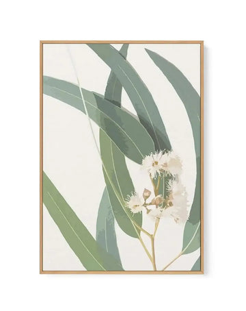 Framed canvas art print featuring an abstract botanical composition with layered eucalyptus leaves in muted sage green and pale green tones overlapping across a cream background. Delicate white clustered flowers with golden centers and thin stems emerge from the lower right, surrounded by the geometric leaf forms. The artwork has a soft, watercolor-like quality with subtle color gradations. Natural wood frame with white border visible around the canvas edges.