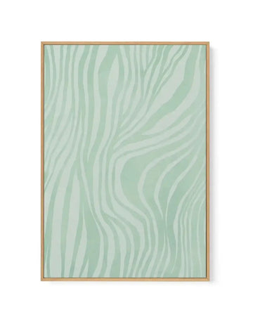 Abstract canvas art print featuring flowing, organic wavy lines in varying shades of sage green, mint green, and cream, creating a fluid, marbled pattern across the composition. The artwork is displayed in a natural wood frame with a light wood-grain finish, shown against a white background.
