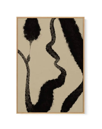 Abstract canvas art print titled Khaki II featuring organic black shapes with textured, speckled edges against a warm beige background. The composition includes flowing curved forms and rounded elements arranged vertically. Natural wood frame with visible grain completes the piece.