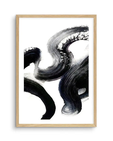 Abstract art print featuring bold, sweeping brushstrokes in black and shades of grey, creating a dynamic, fluid composition on a white background, displayed in a natural oak frame with white border.