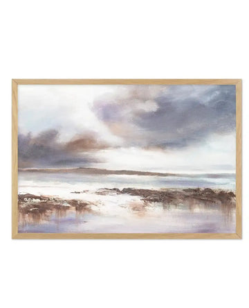 Abstract art print featuring a stormy coastal landscape with a dramatic sky in shades of grey, purple, and brown, reflecting on a calm body of water. The foreground shows dark, textured landmasses and rocks, with subtle reflections of the sky's colours in the water. Printed on fine art paper and displayed in a natural oak frame with white border.