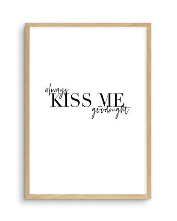 Art print featuring the phrase "always KISS ME goodnight" in black text on a white background, displayed in a natural oak frame with white border. The word "always" is in a delicate, flowing script above the bold, capitalized "KISS ME," with "goodnight" in a similar script below "ME."