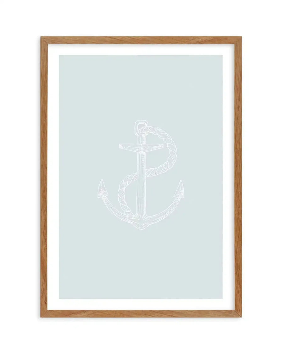 Art print featuring a minimalist white line illustration of an anchor with a rope wrapped around its shank, set against a soft, pale blue background, printed on fine art paper and displayed in a natural oak frame with white border.