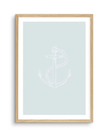 Art print featuring a hand-drawn illustration of a ship's anchor in white outline on a soft, pale blue background, printed on fine art paper and displayed in a natural oak frame with white border.