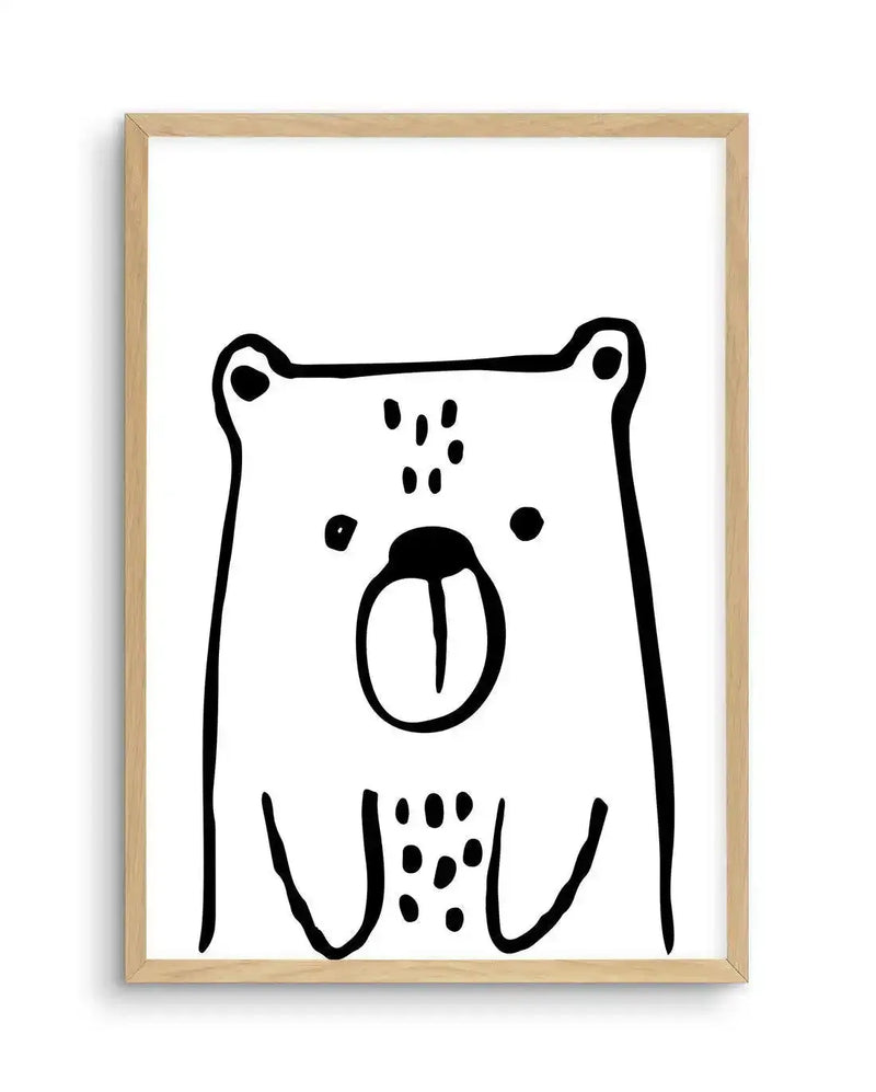 Art print featuring a minimalist black and white illustration of a bear's head and upper body, with a thick, hand-drawn outline and simple dot details for eyes, nose, and fur texture, displayed in a natural oak frame with white border.