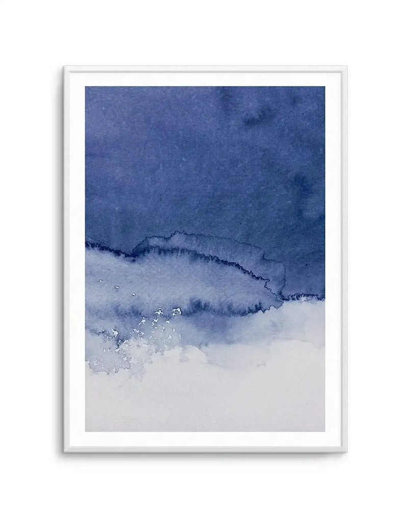 Abstract art print featuring a watercolour composition of deep indigo and navy blue at the top, transitioning to lighter shades of blue and white at the bottom, creating a layered effect suggestive of a stormy sky or ocean waves, displayed in a white frame with a white border.